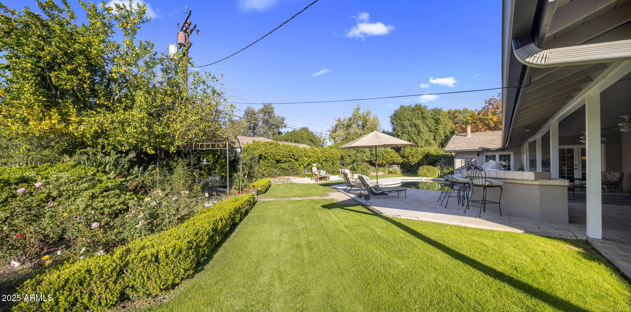 516 West Lawrence Road Phoenix, AZ 85013 - Photo 55 of 65 a swimming pool with outdoor seating and yard