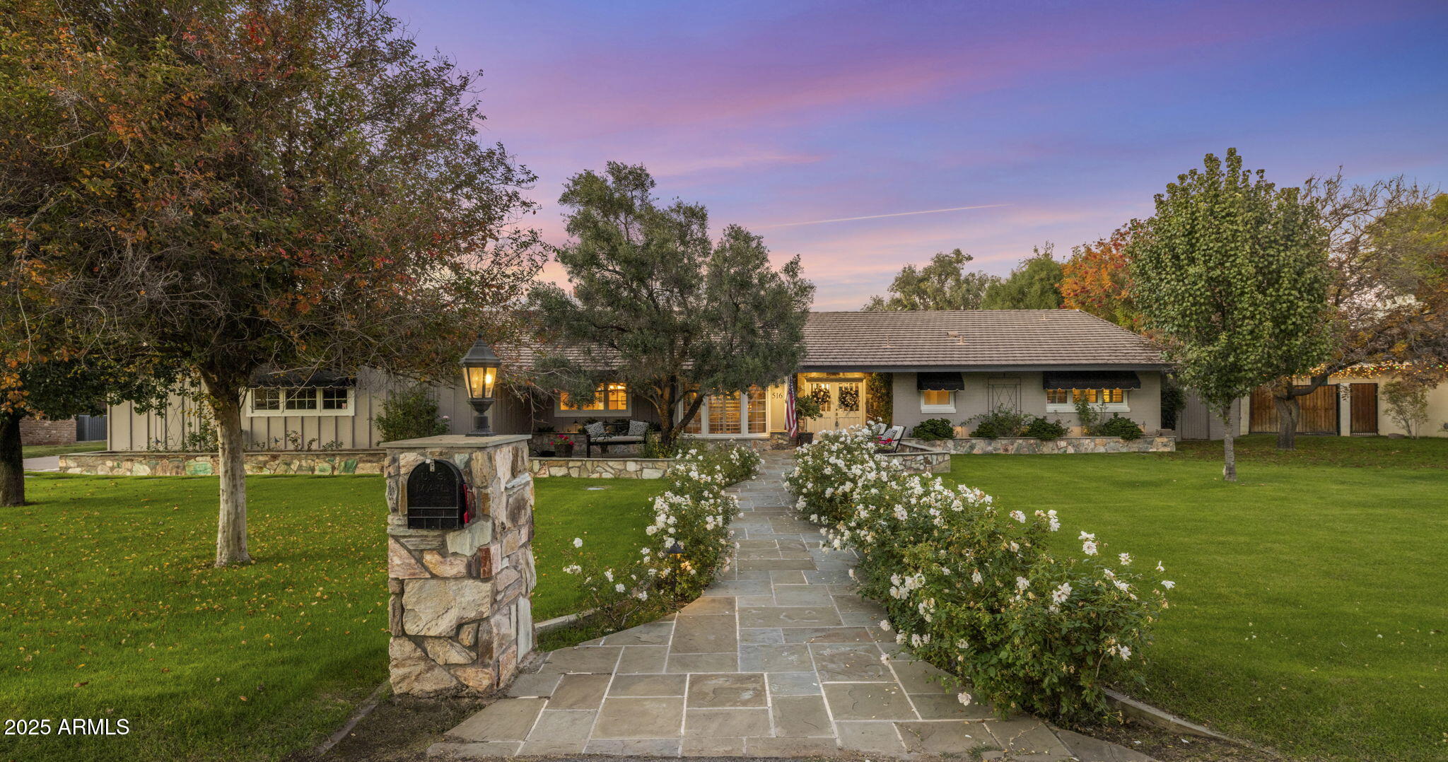 516 West Lawrence Road Phoenix, AZ 85013 - Photo 4 of 65 a front view of a house with a yard