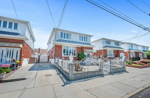 a view of a patio with couches table and chairs and potted plants