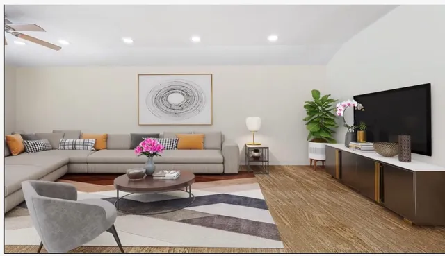 a living room with furniture and a flat screen tv