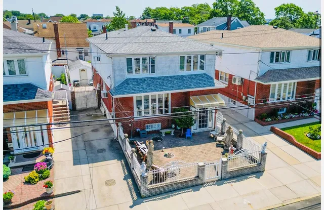 an aerial view of a house with swimming pool