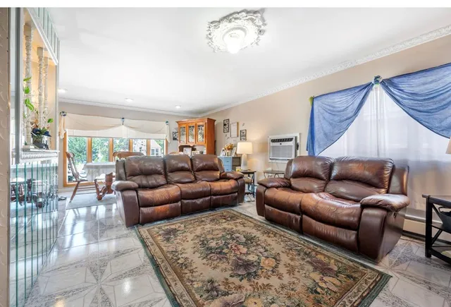 a living room with furniture and a rug