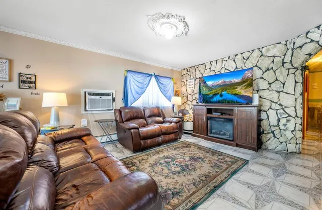 a living room with furniture a couch and a fireplace