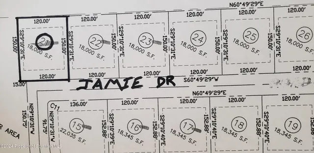 a bathroom with a sink and a white clock