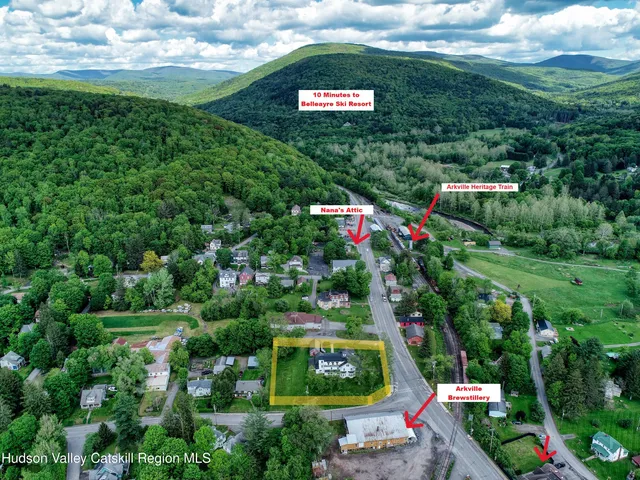 a swimming pool with outdoor seating and yard