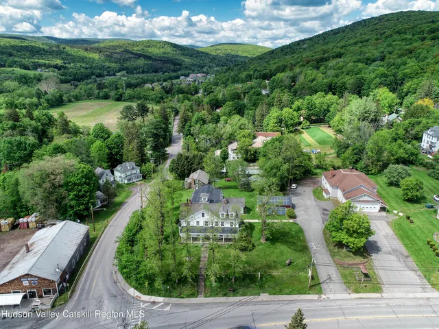 an aerial view of a house with outdoor space