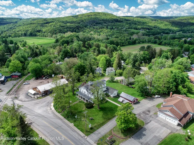 a view of a garden with a building in the background