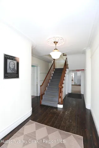 a view of a hallway with staircase