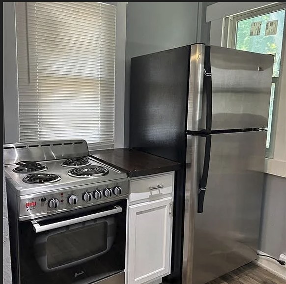 2717 Baldwin Street Columbus, GA 31906 - Photo 2 of 11 a kitchen with a stove and a refrigerator