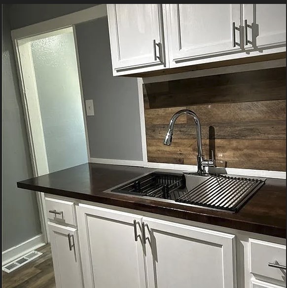 2717 Baldwin Street Columbus, GA 31906 - Photo 3 of 11 a close view of sink a microwave and cabinets