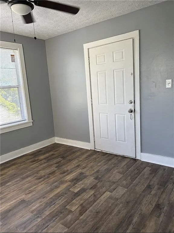 2717 Baldwin Street Columbus, GA 31906 - Photo 8 of 11 a view of an empty room with wooden floor and a window