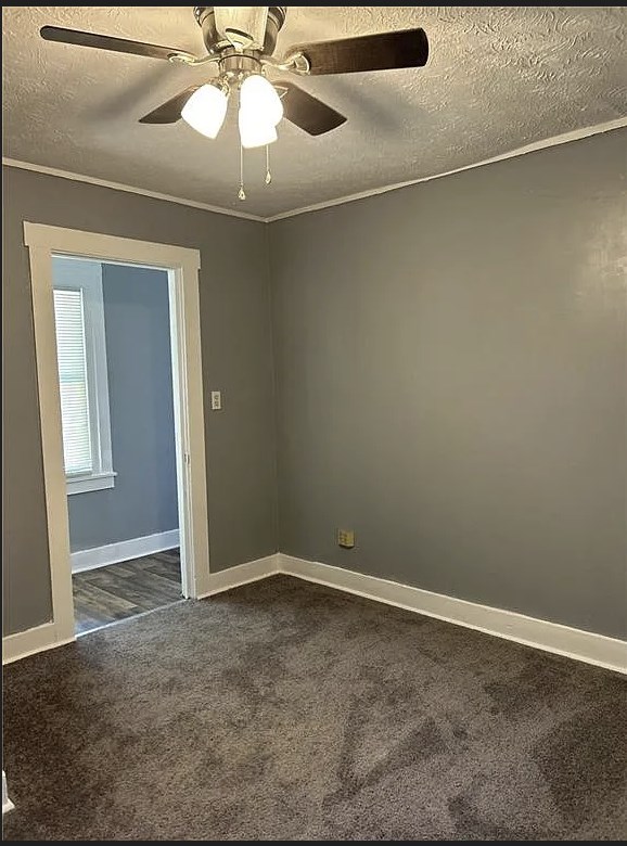 2717 Baldwin Street Columbus, GA 31906 - Photo 10 of 11 an empty room with a chandelier fan