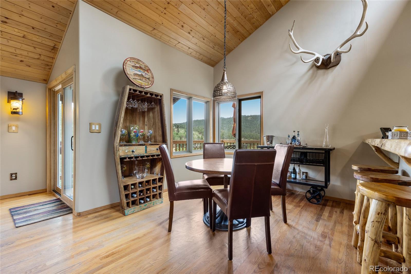 193 Twilight Terrace Drive Bailey, CO 80421 - Photo 15 of 50 a view of a dining room with furniture and wooden floor