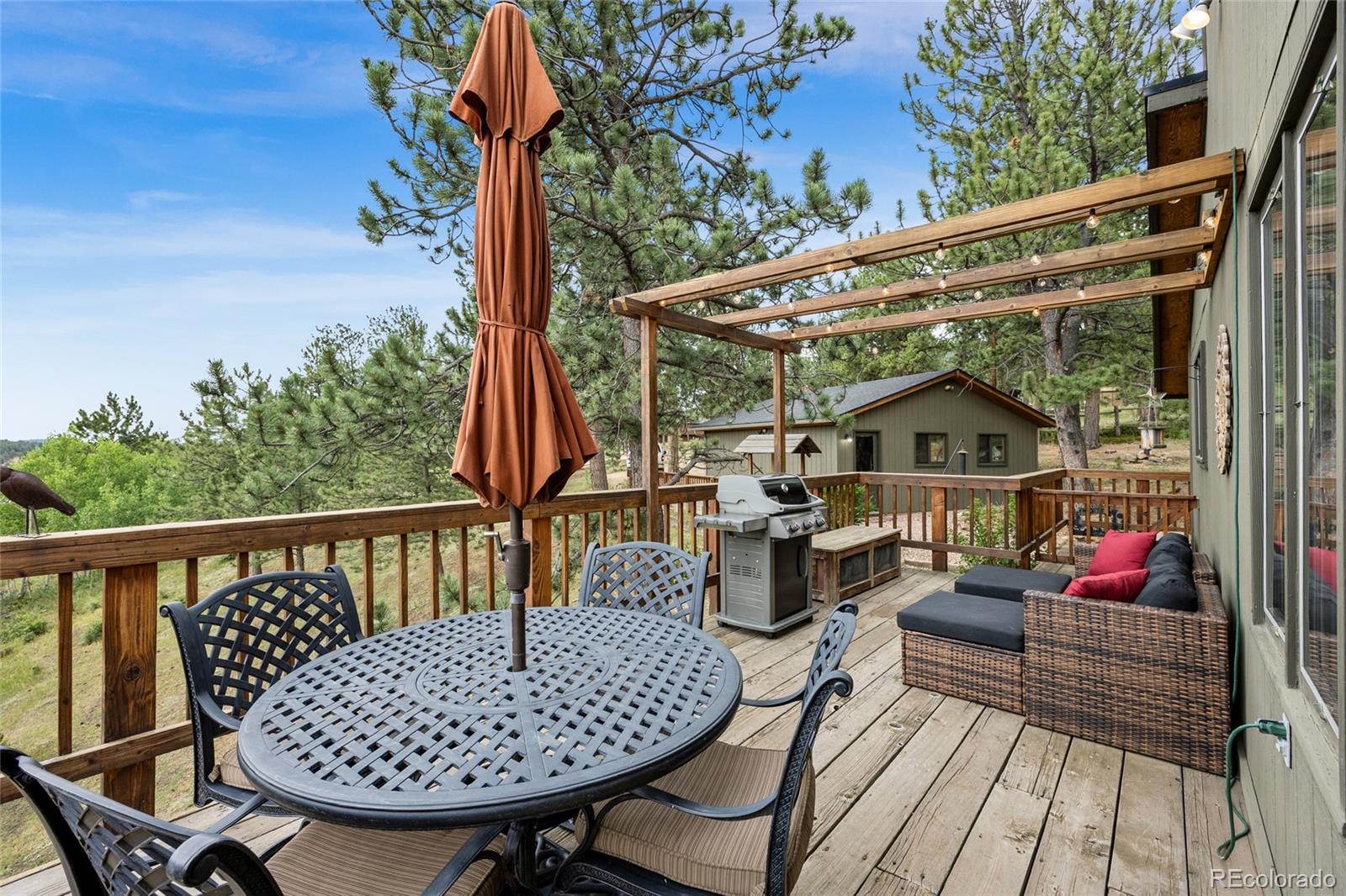 193 Twilight Terrace Drive Bailey, CO 80421 - Photo 18 of 50 a view of balcony with wooden floor and outdoor seating