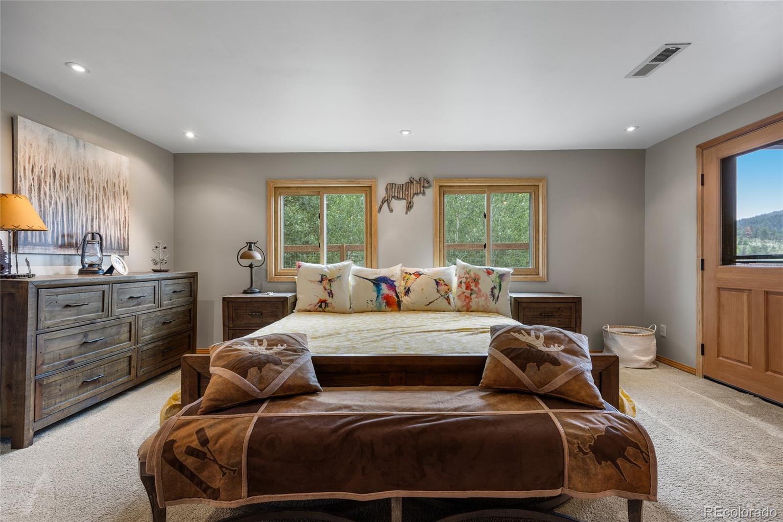 193 Twilight Terrace Drive Bailey, CO 80421 - Photo 25 of 50 a bedroom with a bed and a dresser