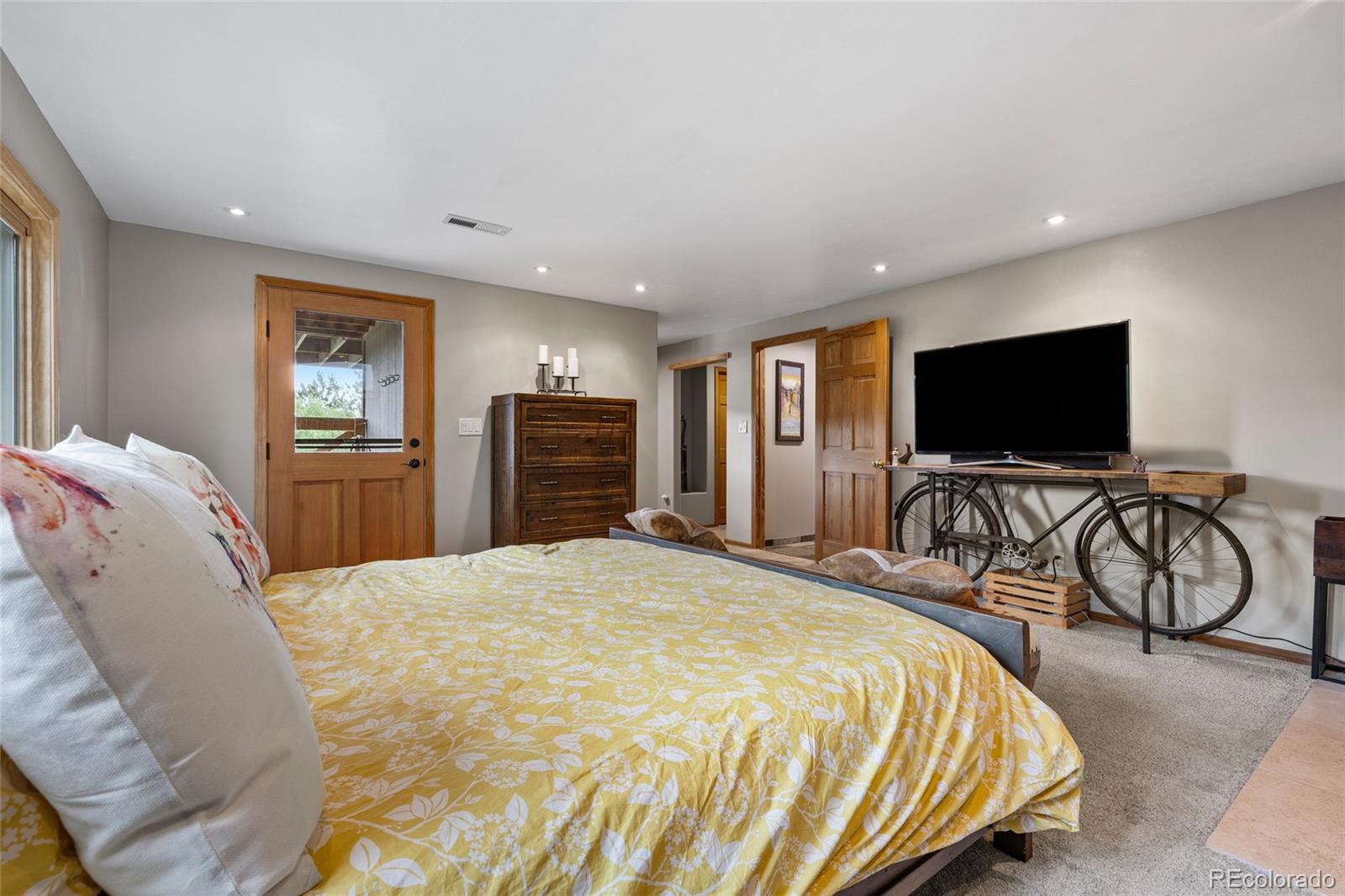 193 Twilight Terrace Drive Bailey, CO 80421 - Photo 26 of 50 a bedroom with bed tv and flat screen tv