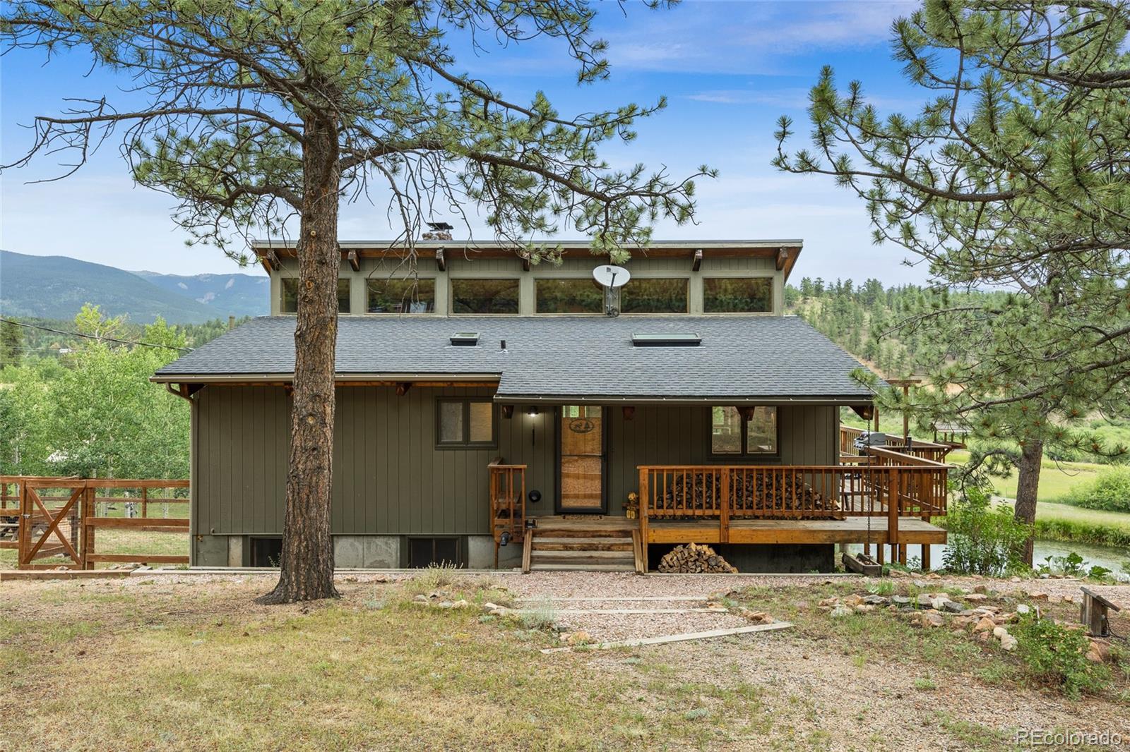 193 Twilight Terrace Drive Bailey, CO 80421 - Photo 45 of 50 front view of a house with a large tree
