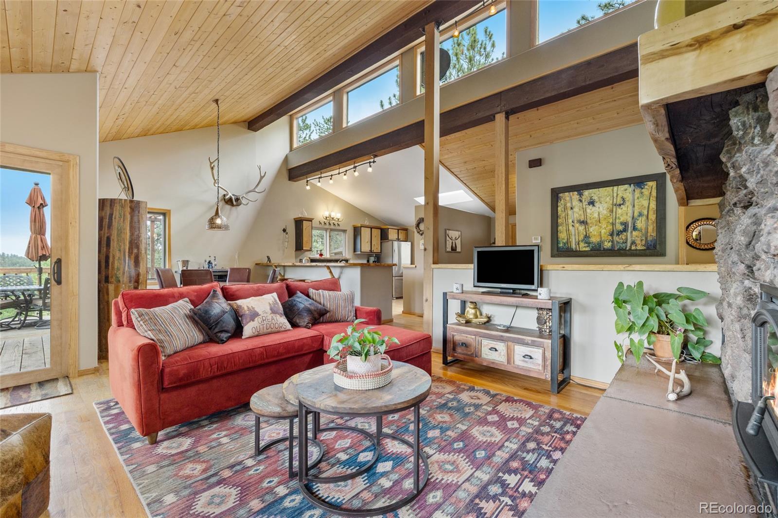 193 Twilight Terrace Drive Bailey, CO 80421 - Photo 9 of 50 a living room with furniture and a flat screen tv