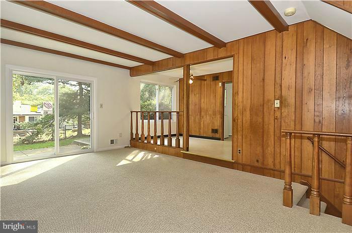 1908 Snowdrop Lane Silver Spring, MD 20906 - Photo 8 of 21 Family Room with wood-beamed ceiling