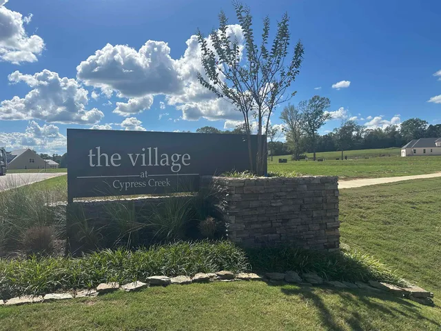a view of a lake with a big yard