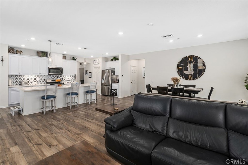 7598 Orangebrook Cove Riverside, CA 92507 - Photo 16 of 45 Open Space Kitchen overlooking the Living Area
