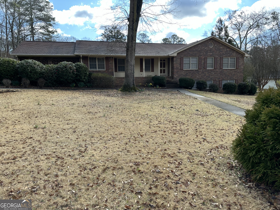 245 Kings Road Athens, GA 30606 - Photo 1 of 1 a front view of a house with a garden