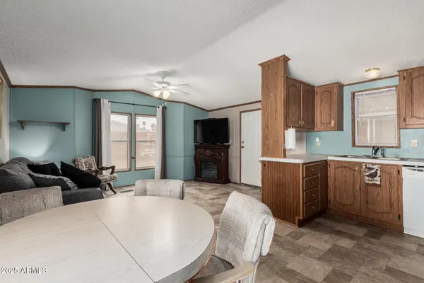 a large bedroom with a large bed a flat tv screen and attached closet