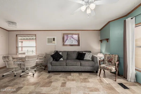 a living room with furniture and a window