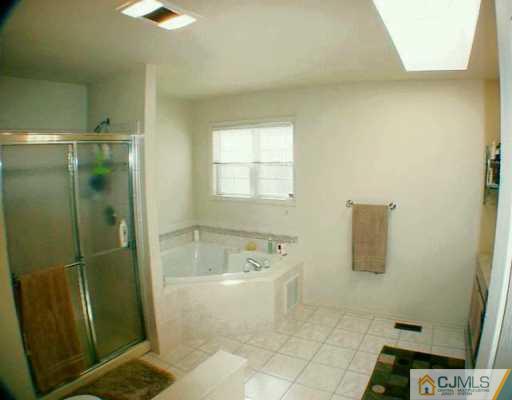 52 Stratton Road Old Bridge, NJ 07747 - Photo 6 of 8 a bathroom with a bathtub and shower
