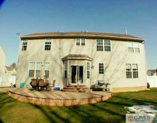 52 Stratton Road Old Bridge, NJ 07747 - Photo 8 of 8 a view of a white house with swimming pool in front of it