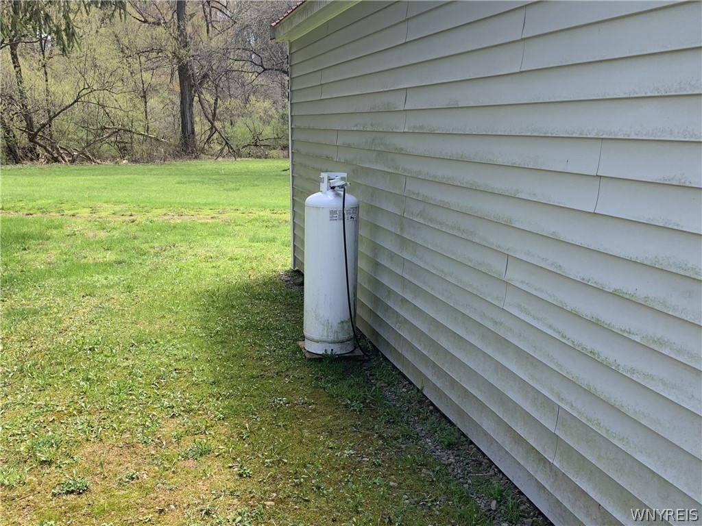 2574 Clark Road Arcade, NY 14024 - Photo 8 of 23 small propane tank for wall heater.