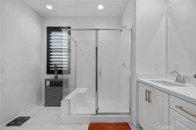 a bathroom with a shower and a sink