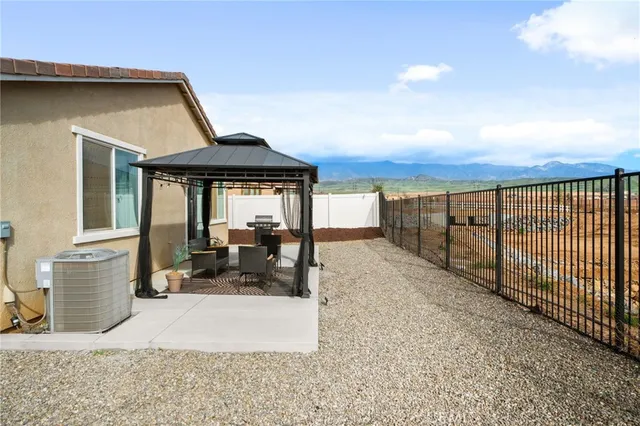 a view of a patio with couches and potted plants
