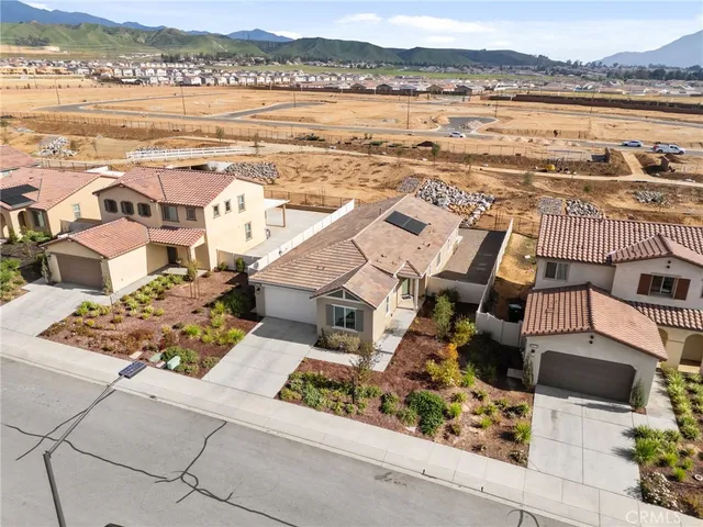 an aerial view of residential building with outdoor space and ocean view