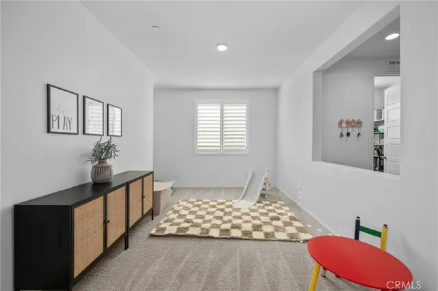 a bedroom with furniture and window