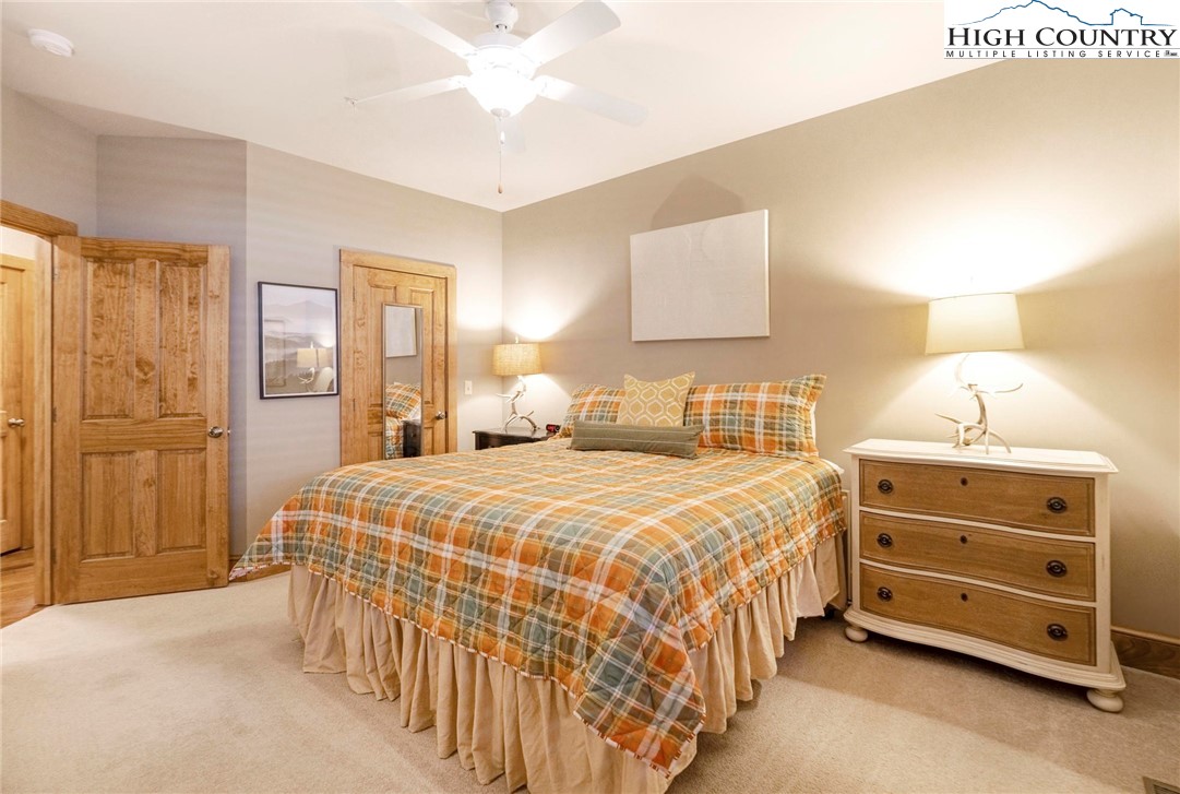 152 Red Tail Summit, Unit CI2 Boone, NC 28607 - Photo 21 of 33 a bedroom with a bed and a cabinets