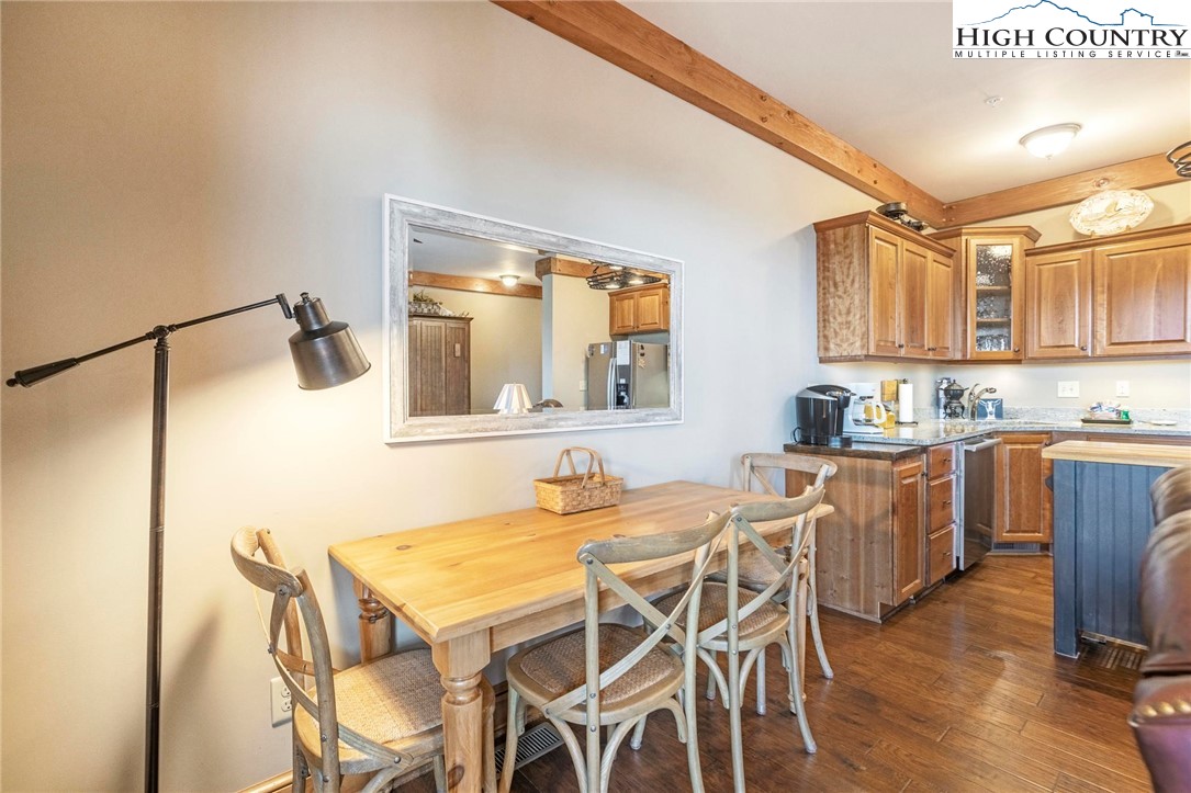 152 Red Tail Summit, Unit CI2 Boone, NC 28607 - Photo 9 of 33 a kitchen with a table and chairs in it