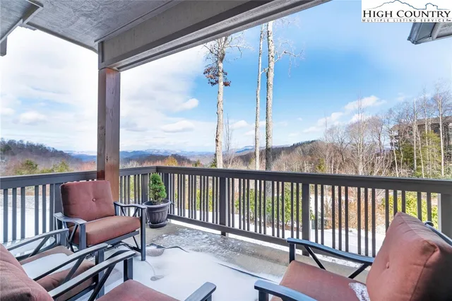 a view of a balcony with furniture