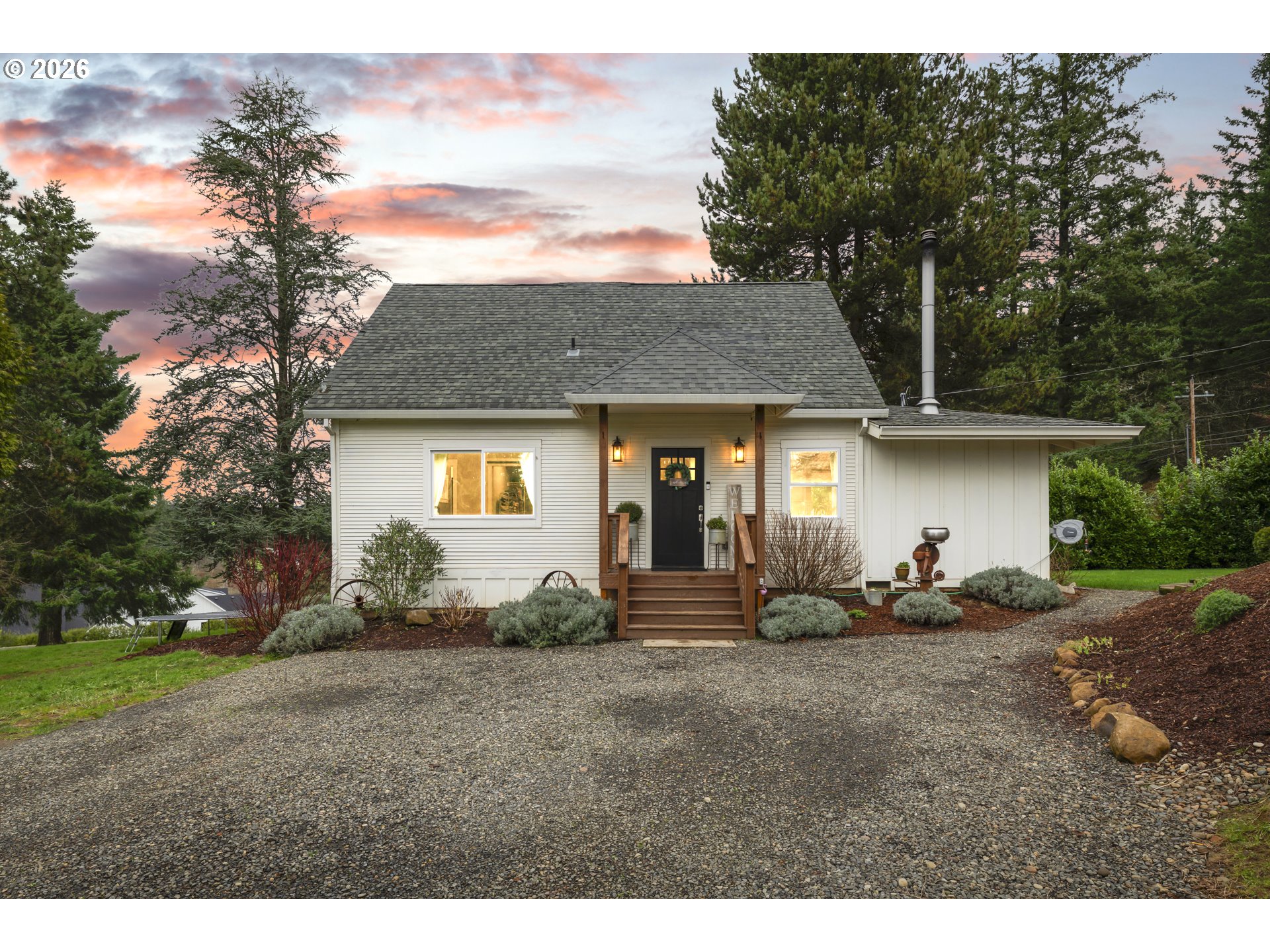16453 Forsythe Road Oregon City, OR 97045 - Photo 1 of 48 a front view of a house with a garden