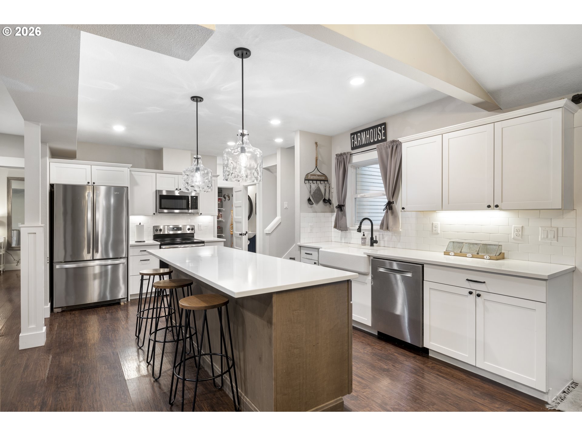 16453 Forsythe Road Oregon City, OR 97045 - Photo 12 of 48 a kitchen with stainless steel appliances kitchen island a sink refrigerator and cabinets