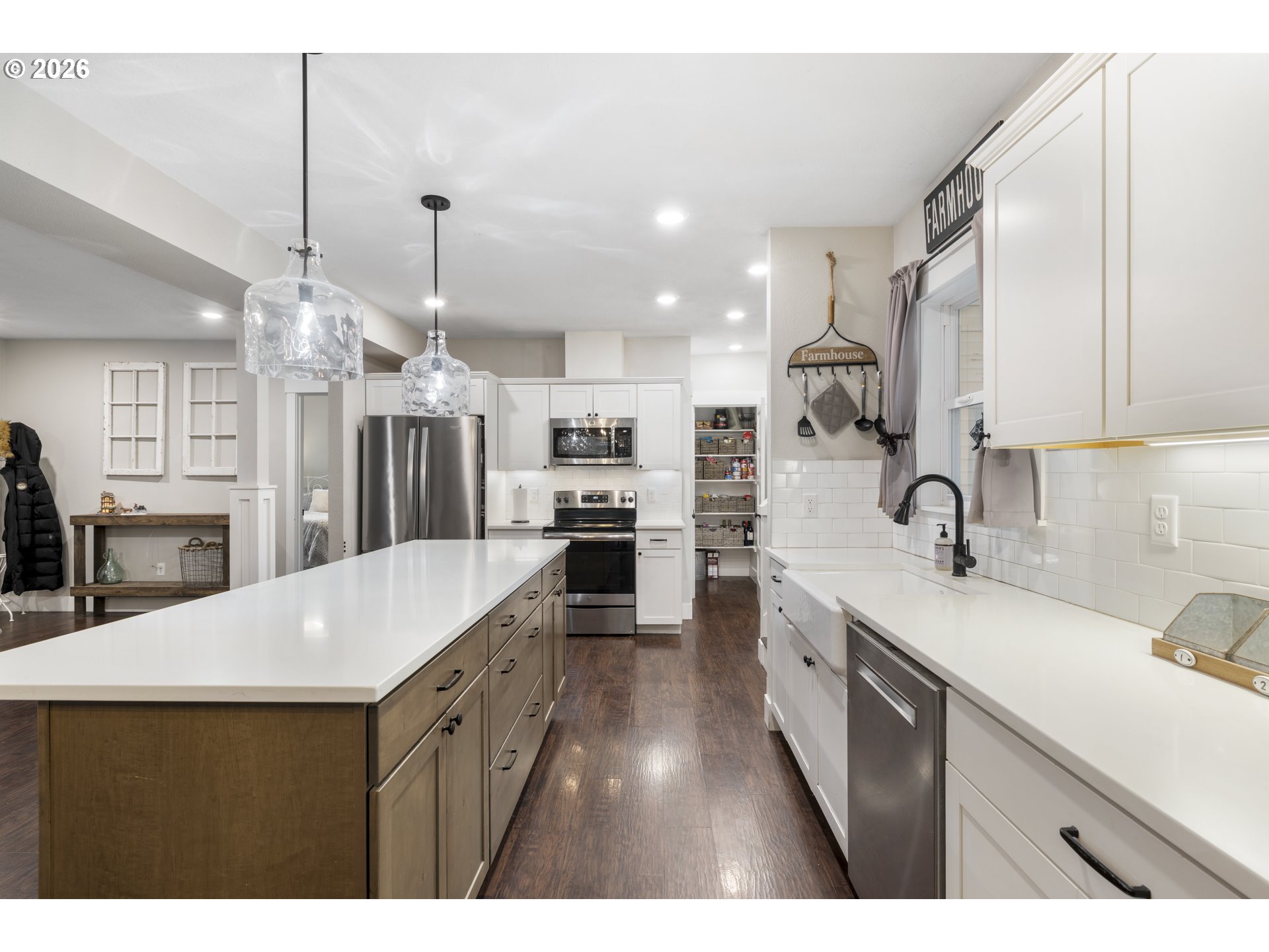 16453 Forsythe Road Oregon City, OR 97045 - Photo 14 of 48 a kitchen with stainless steel appliances kitchen island a sink stove and cabinets