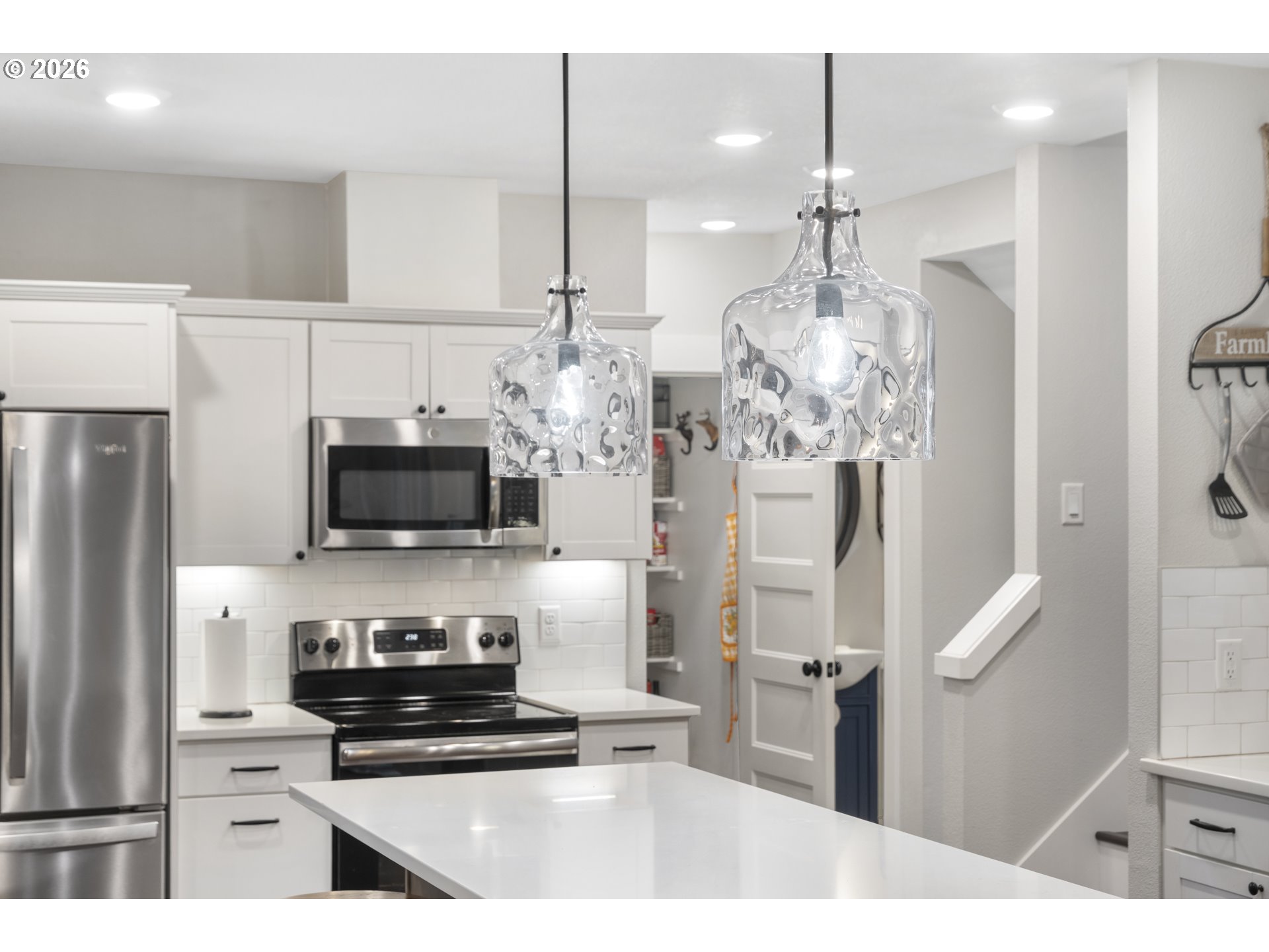 16453 Forsythe Road Oregon City, OR 97045 - Photo 16 of 48 a kitchen with stainless steel appliances a refrigerator sink and microwave