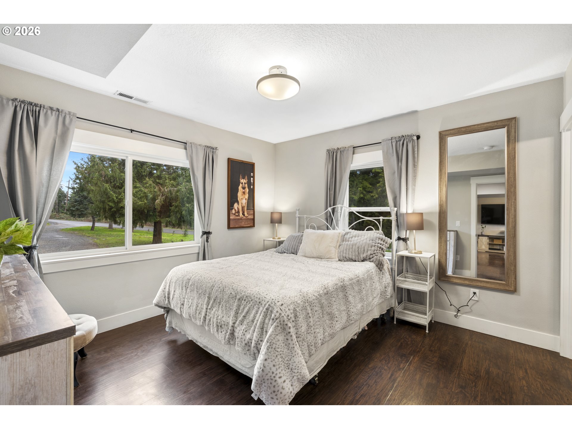 16453 Forsythe Road Oregon City, OR 97045 - Photo 18 of 48 a bedroom with a large bed and a large window