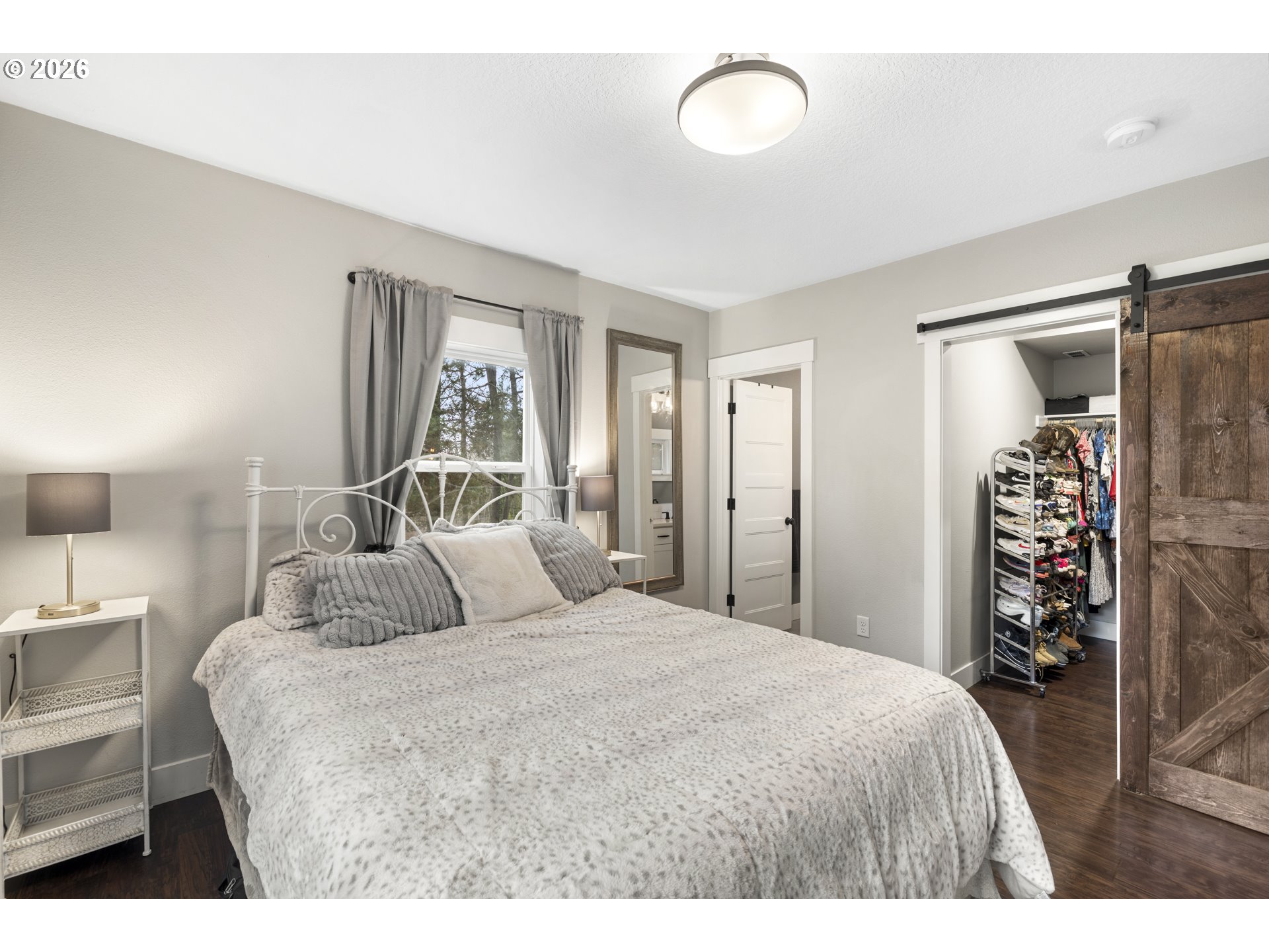 16453 Forsythe Road Oregon City, OR 97045 - Photo 20 of 48 a bedroom with a bed and a walk in closet