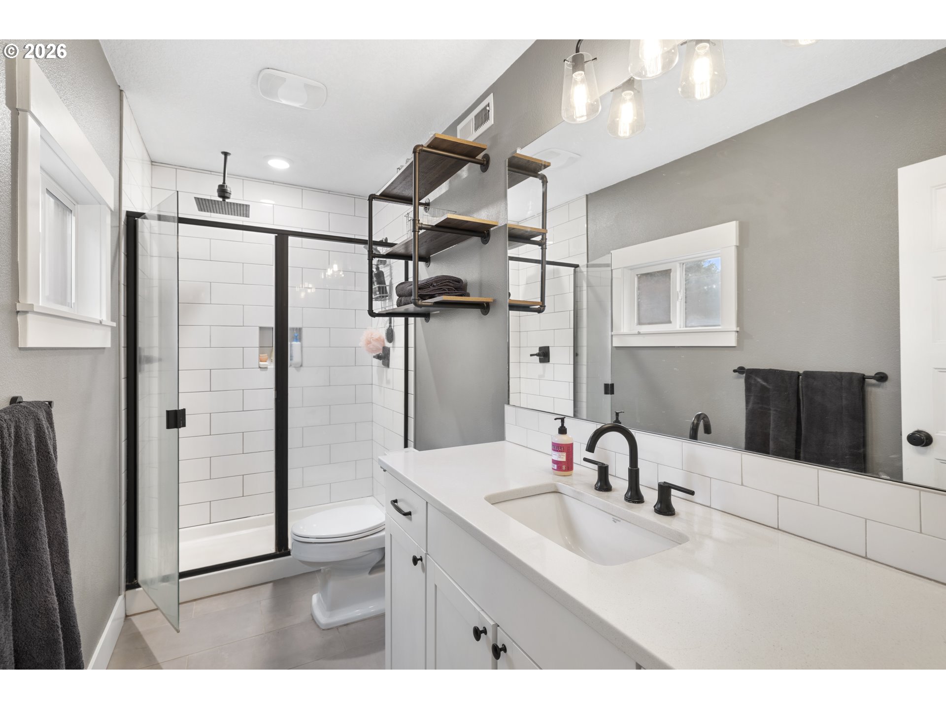 16453 Forsythe Road Oregon City, OR 97045 - Photo 22 of 48 a bathroom with a double vanity sink mirror and shower