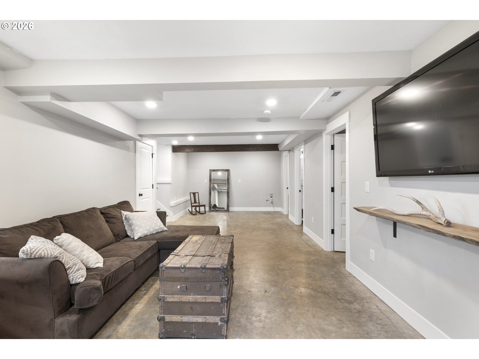 16453 Forsythe Road Oregon City, OR 97045 - Photo 24 of 48 a living room with furniture and a flat screen tv