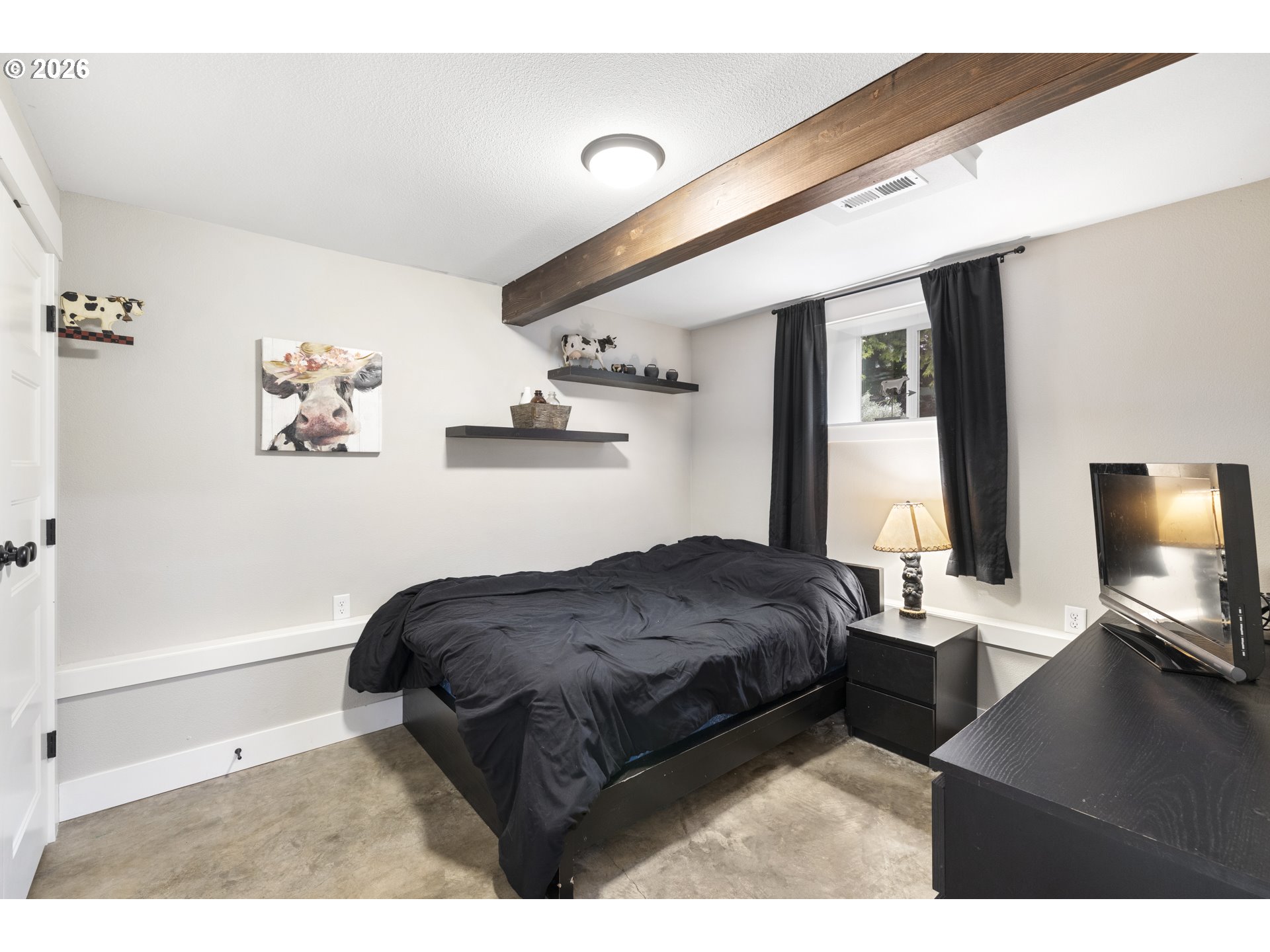 16453 Forsythe Road Oregon City, OR 97045 - Photo 29 of 48 a bedroom with a bed window and a flat screen tv