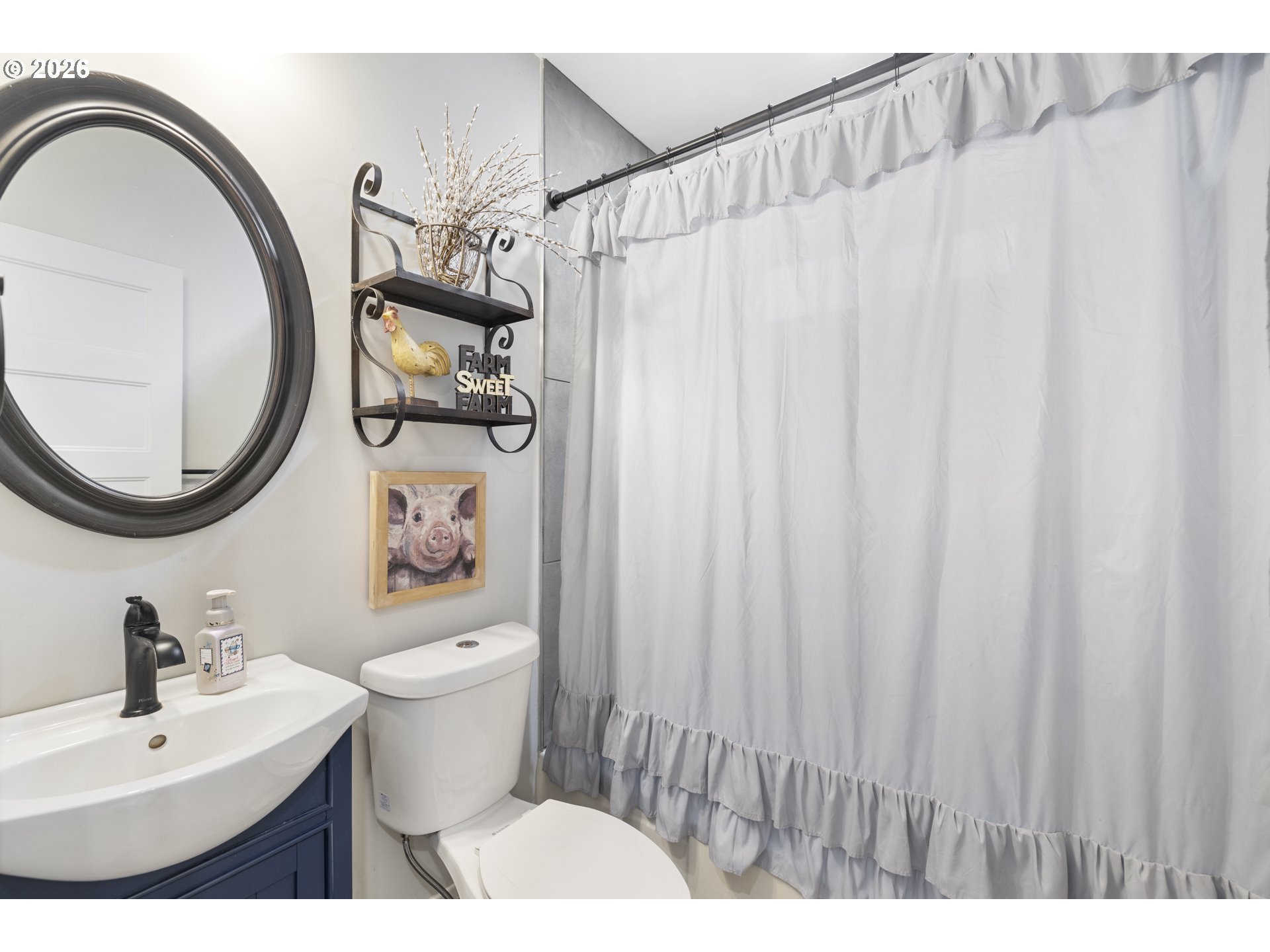 16453 Forsythe Road Oregon City, OR 97045 - Photo 30 of 48 a bathroom with a sink a mirror and a toilet
