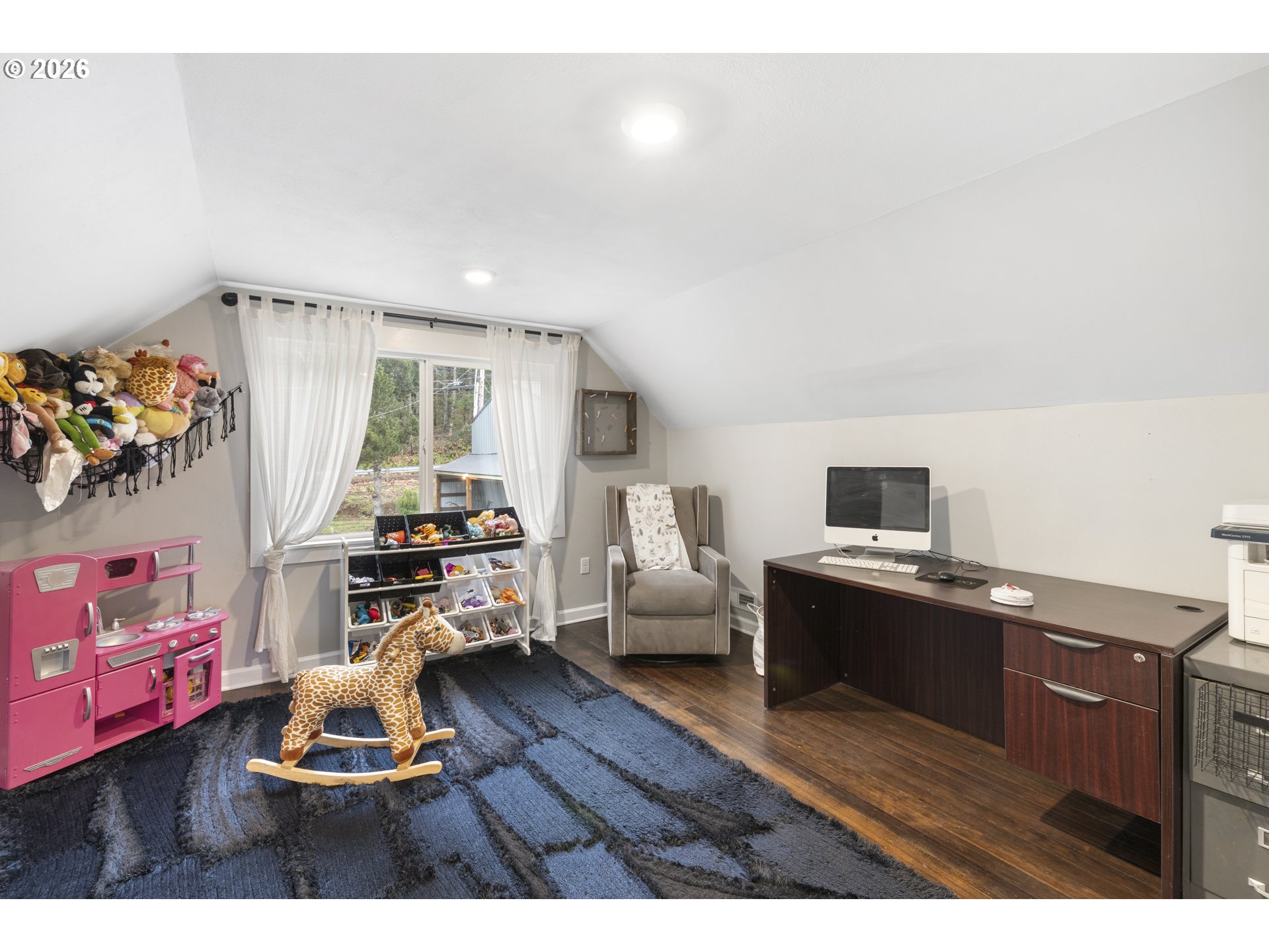 16453 Forsythe Road Oregon City, OR 97045 - Photo 33 of 48 a living room with furniture and a wooden floor