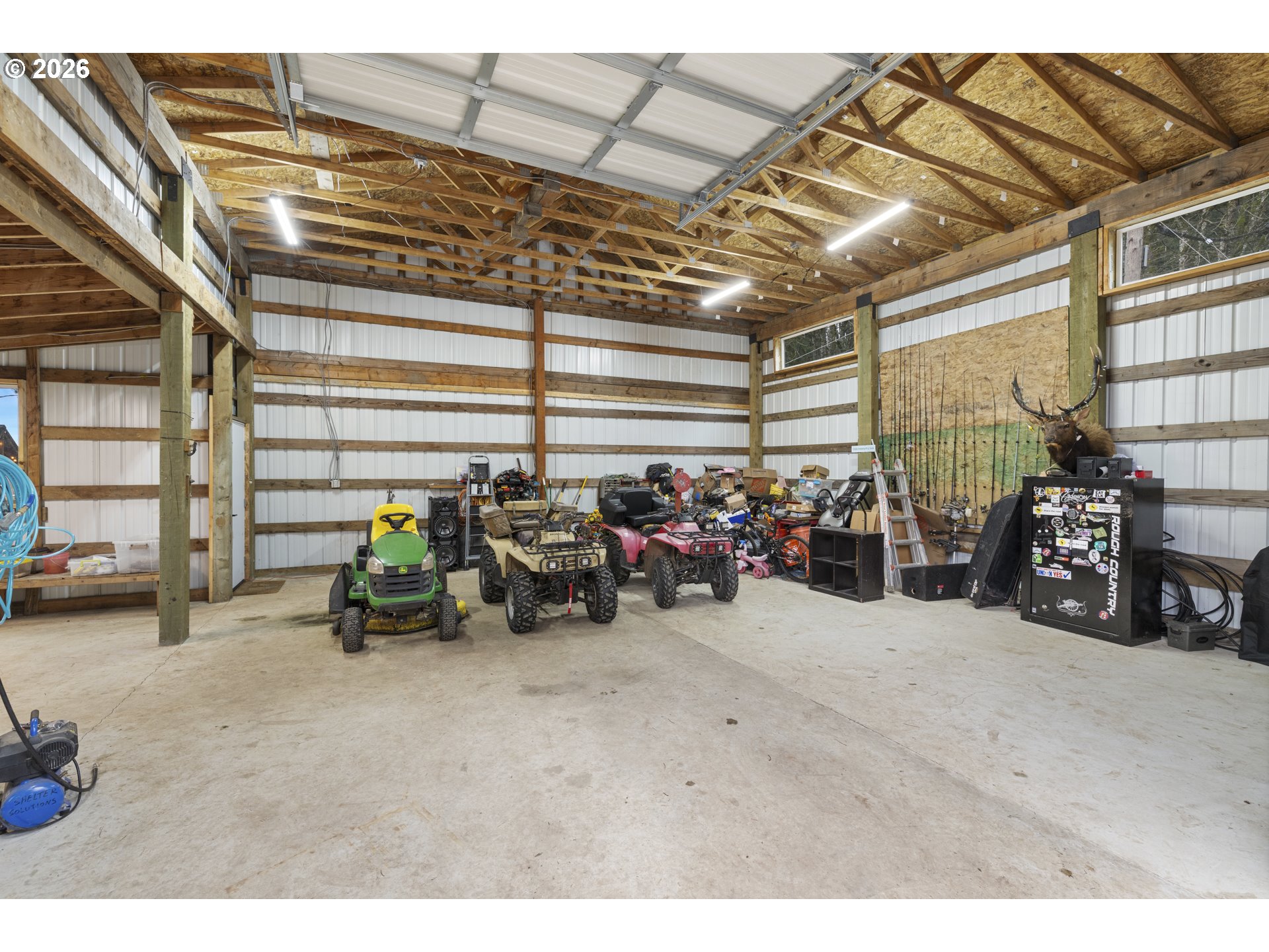 16453 Forsythe Road Oregon City, OR 97045 - Photo 36 of 48 a view of a garage with a bike and car